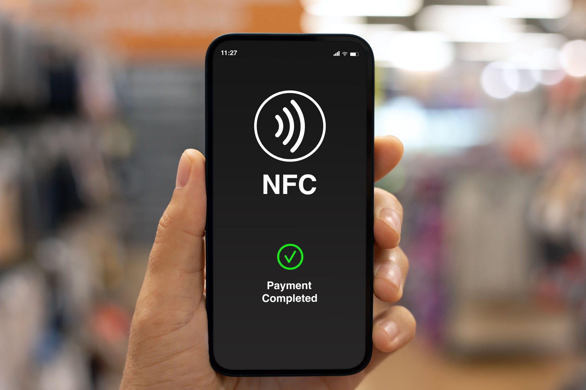 Male hand phone pay wireless technology nfc via pos terminal